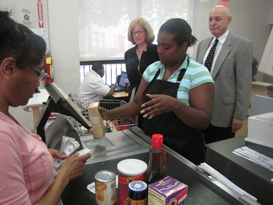 A file photo of a trainee in New Community’s Gateway-To-Work Supermarket Career Program practices cashiering at the ShopRite training facility housed at NCC.