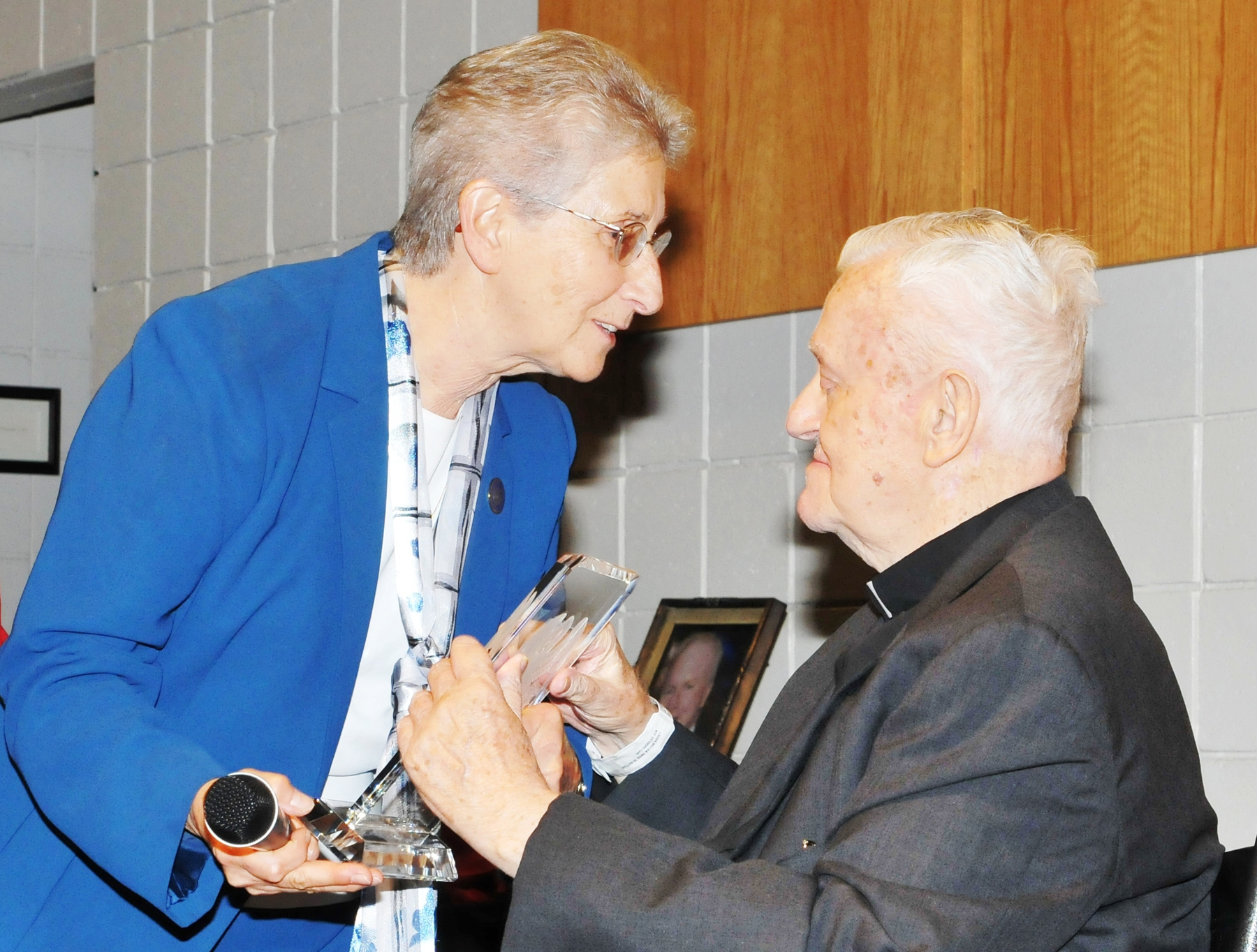 Monsignor award Sr. June presents Pelican award