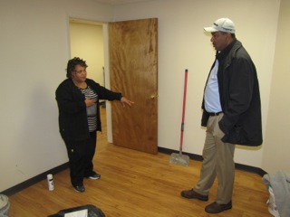 Sharon Pleasant-Jones, left, Director of Health and Social Services, points out the area where the patient exam table will be in the new clinic at NCC Commons Senior to Environmental Services Director Wayne Gravesande, right.
