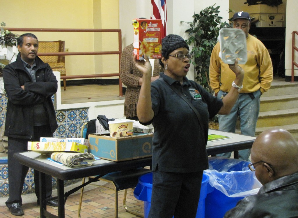 Recycling Coordinator Brenda Anderson from the City of Newark shows two examples of paper products that must be recycled: an empty box of pancake mix and a cardboard drink tray.