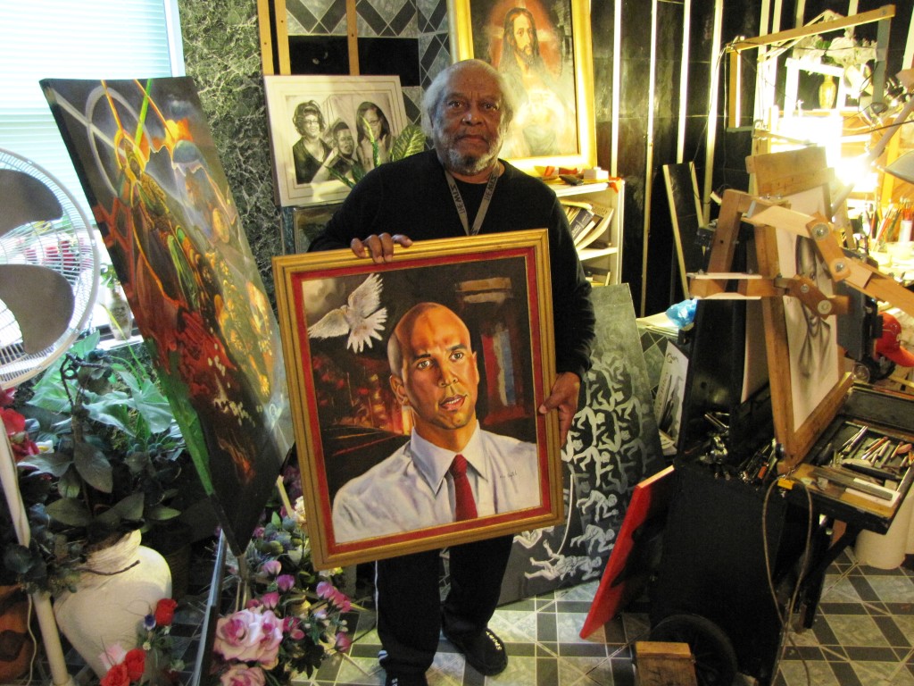 John Aytch, a resident of NCC Gardens Senior, holds a portrait of U.S. Sen. Cory Booker that he painted during Booker’s earlier years as mayor of Newark.