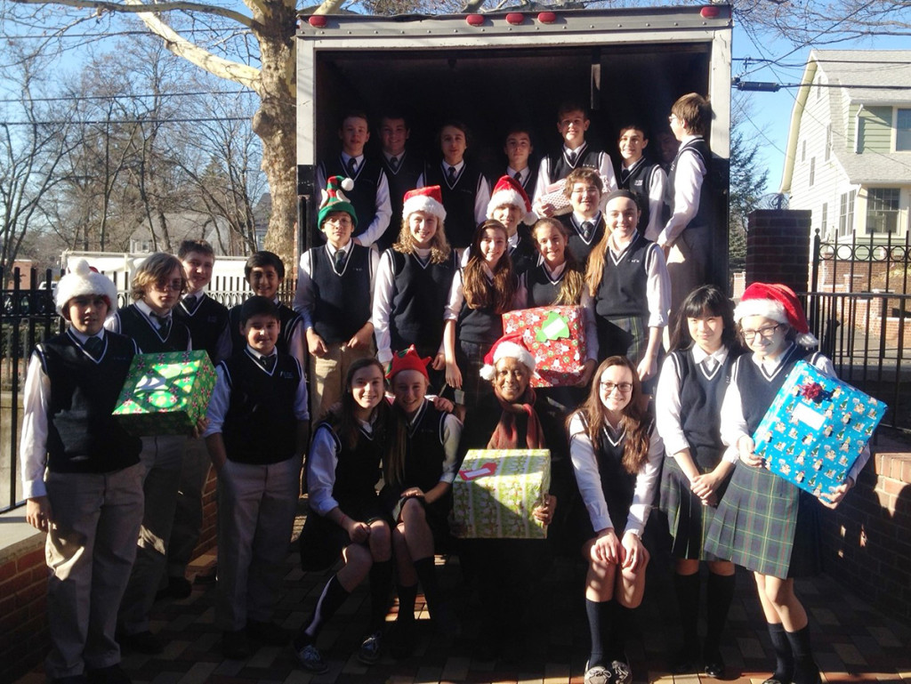 Students from St. Rose of Lima Academy in Short Hills filled the truck with gifts and surrounded Madge Wilson, seated first row.