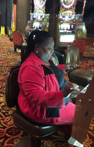 Atlantic City senior trip woman at slot machine