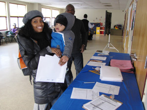 CHELC financial planning parent with child at registration