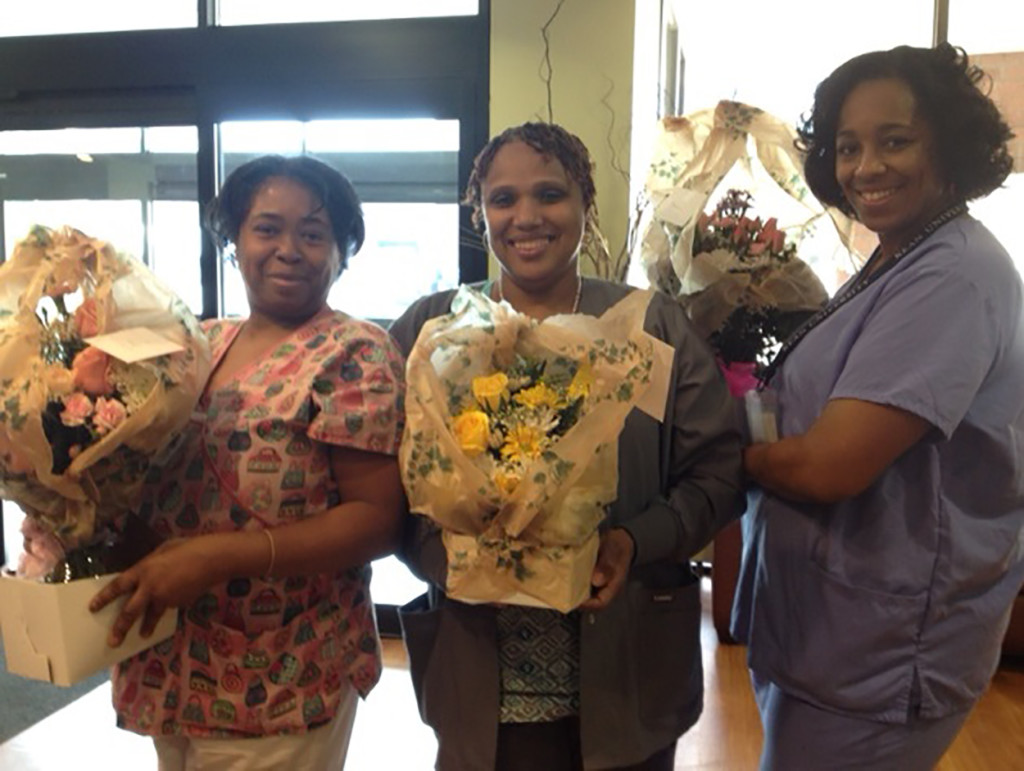 Three nurses from the Extended Care Facility received perfect scores during their medication administration reviewed by the New Jersey Department of Health during the nursing home’s certification survey from February 11 to February 20. From left: Sheila Coleman, Robyn Moses and Maria Cruz all received flowers for their successful efforts. Photo courtesy of Robert Smolin.