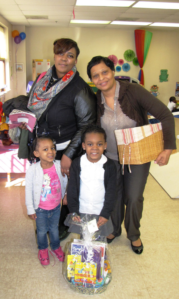 Family Literacy Night Ms. Yvette and raffle winner family