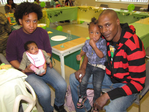 The Family Service Bureau’s New Start program celebrated Mother’s Day by hosting a luncheon for families including, from left, Shaquanna Reddick, Zanovia, age 3 months, Zanilah, age 2, and Gerrell Henry.