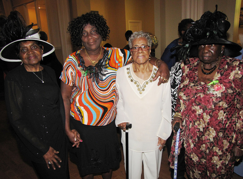 Contest winners, from left: Jameelah Martin (best hat), Walterine Hatton (most children, 12), Pearl Nickerson (oldest mother, age 90), and Anna Sherman (best dress).