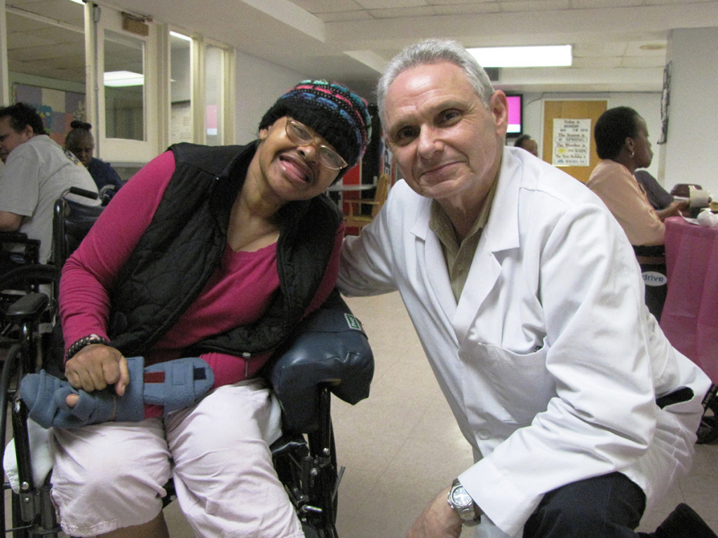 Crystal McCoy, left, a resident of New Community Extended Care, with podiatrist Dr. Robert Kosofsky.