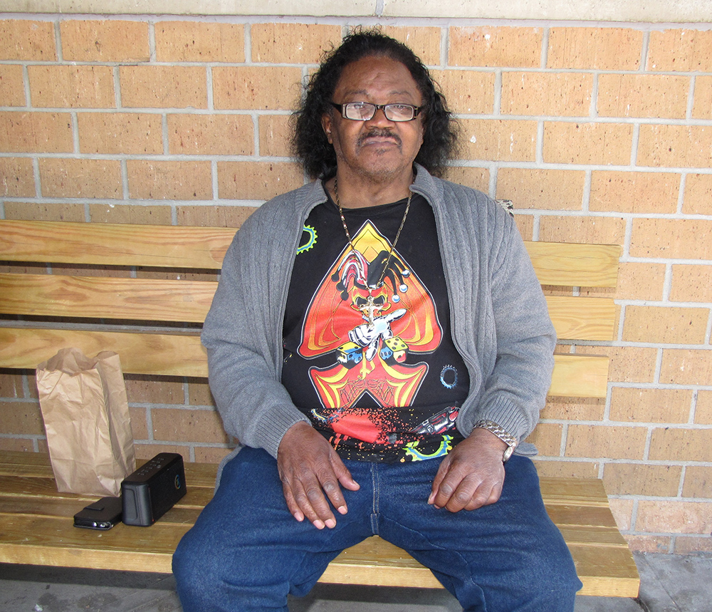 Claude Goodson can often be found perched on a bench at New Community Commons Senior with music playing from his portable speaker.