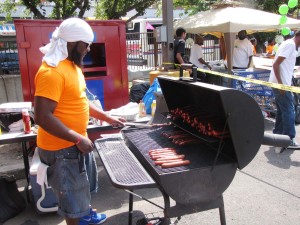 Derek White volunteered to man the grill at Harmony Day and served up hot dogs for those who attended the resource fair.