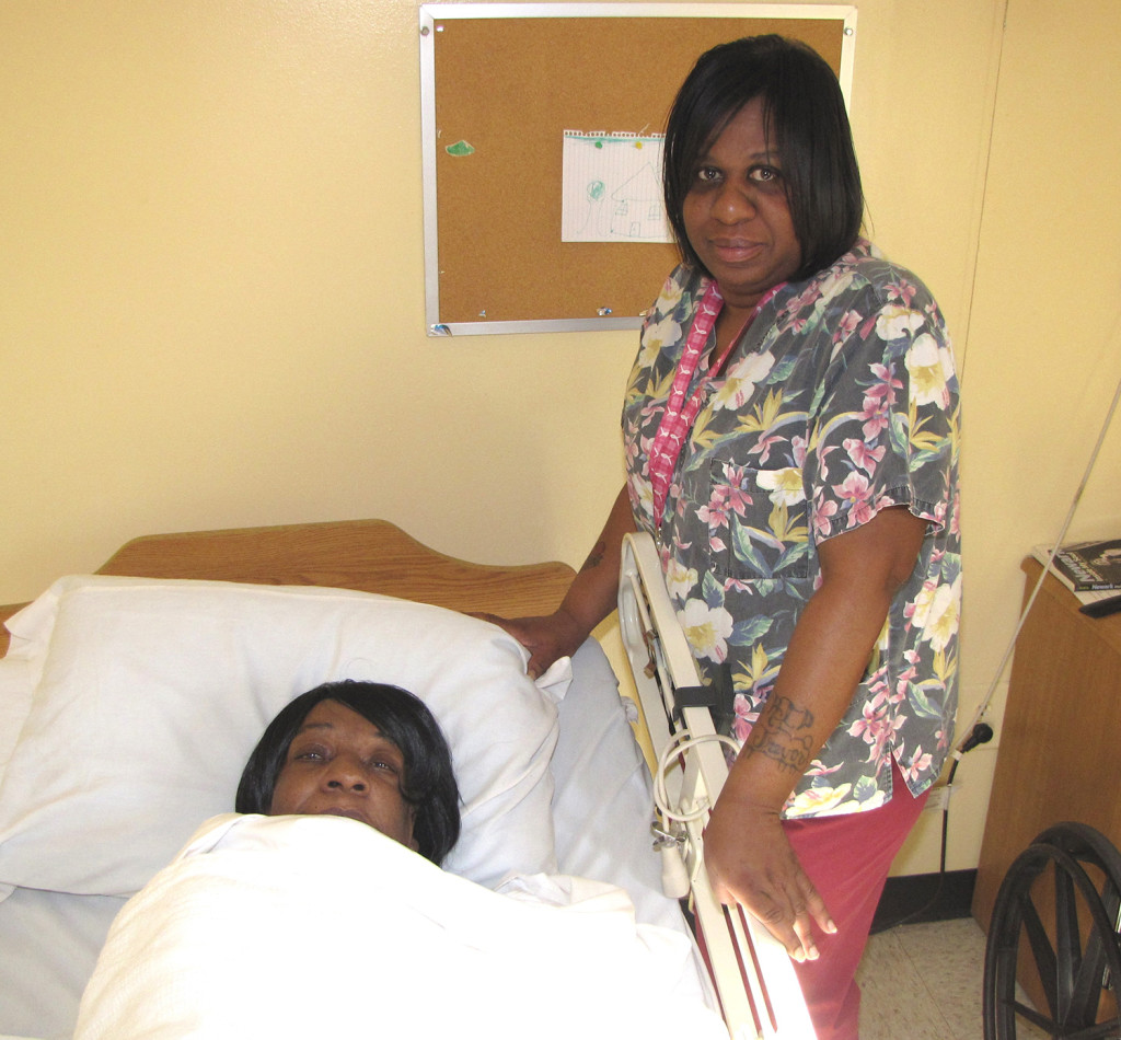 Robin Harris, right, a licensed practical nurse at New Community Extended Care, is able to visit her mother, Cheryl, left, at the nursing home.
