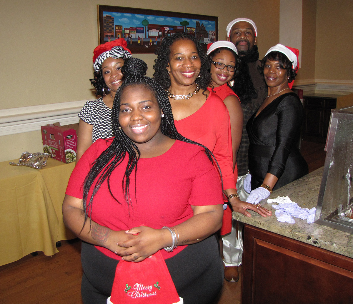 Fancy and out of uniform, members of the New Community Security Department dressed to impress for their holiday party.