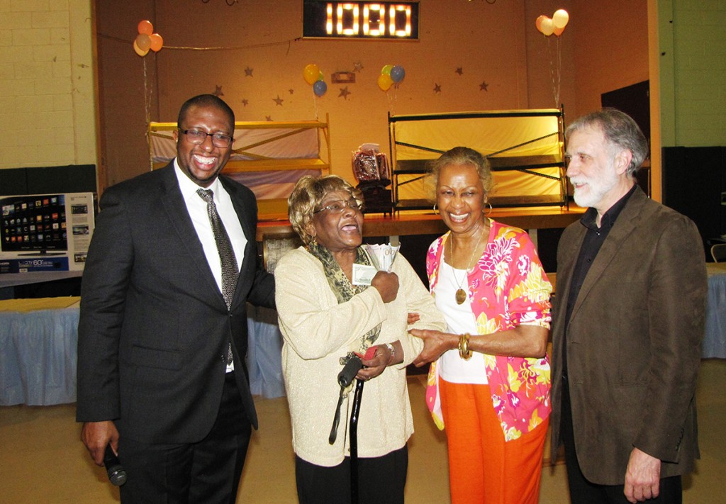 File photo from last year’s Spring Festival of (from left) Edgar Nemorin, NCC board member; 50/50 cash raffle winner Gloria Harrison of New Community Commons Senior; Madge Wilson, NCC board member; and Richard Cammarieri, director of special projects.