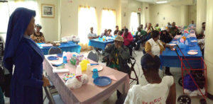 Residents of New Community Gardens Senior gathered to celebrate both Father’s and Mother’s Day at a luncheon organized by Health and Social Services.