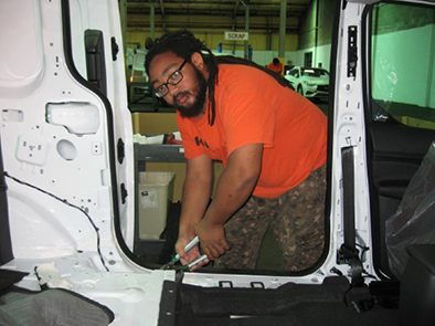 Ashton Merritt, a graduate of New Community’s automotive program, has worked at FAPS Inc. for a year.
