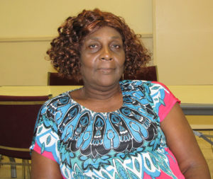 Walterine Hatton assists fellow residents of New Community Manor Senior and helps  keep her building clean.