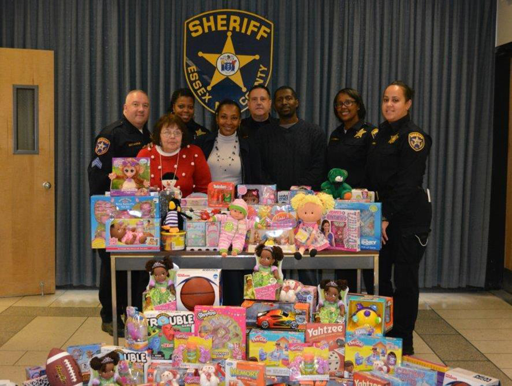 Protect and serve: The Essex County Sheriff’s Office donated sports equipment, board games, dolls and stuffed animals to the New Community Family Resource Success Center during the holiday season.  Many thanks to Sheriff Armando Fontoura and his staff for holding a toy drive that provided gifts to many families in need in the greater Newark area this holiday season. The Family Resource Success Center is a one-stop center that connects individuals to resources within the NCC network as well as to outside agencies. The center’s new location is 274 South Orange Ave. in Newark. For more information, call the center at 973-565-9500. Photo courtesy of Kevin Lynch.
