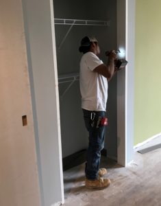 Closet doors being installed in a unit of A Better Life.