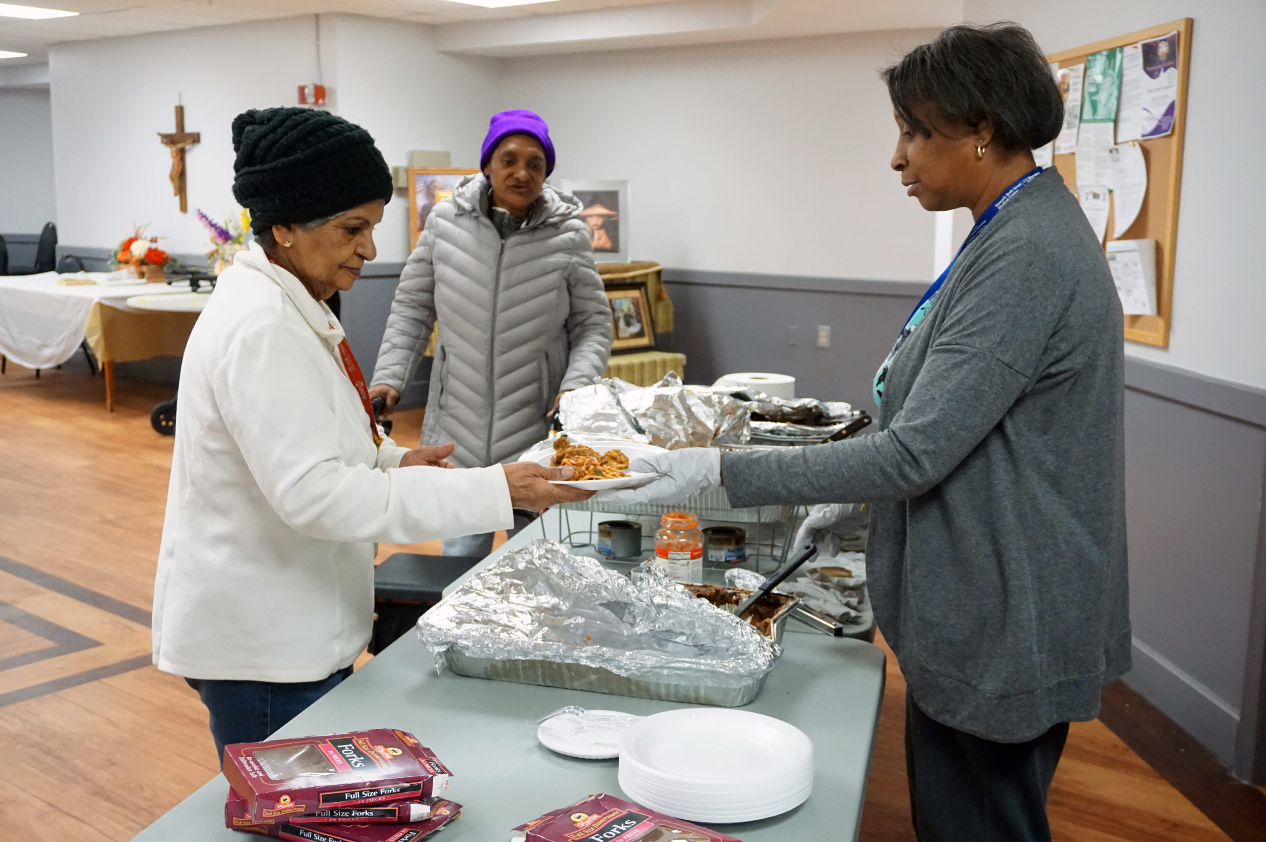Commons Senior Black History Celebration Jill DeRios Serving Food