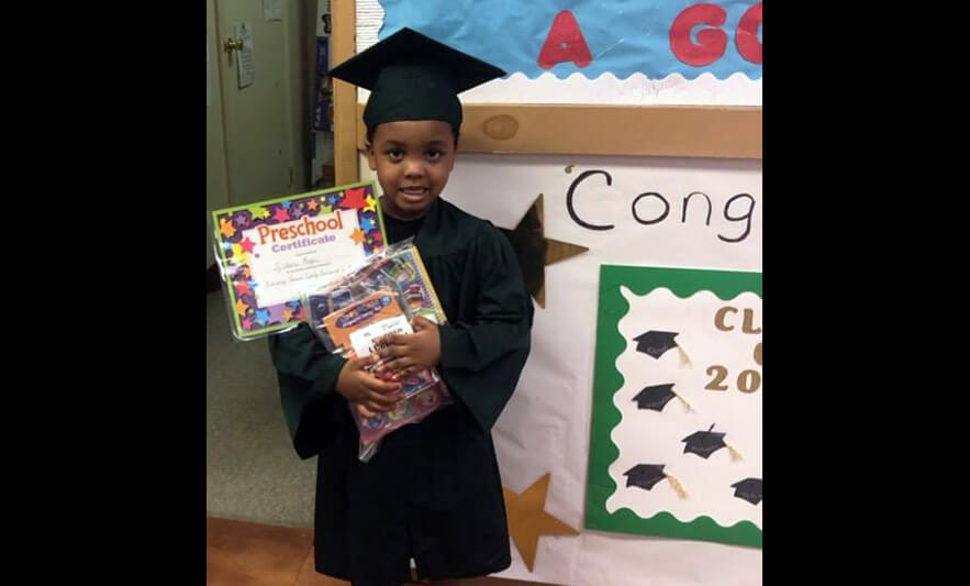 HHELC Graduation 2020 Boy with Supplies and Certificate Black Background