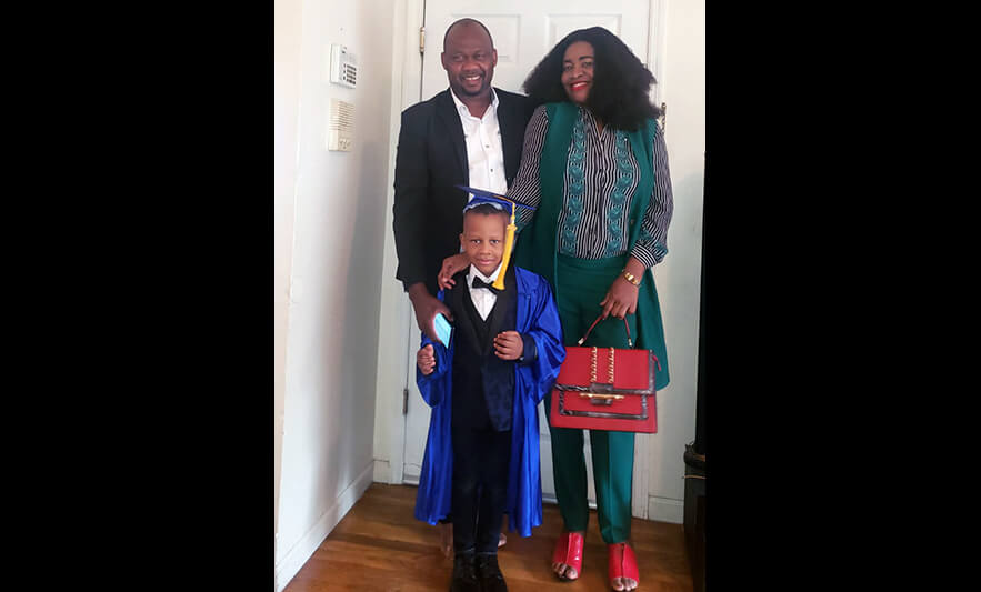 HHELC Graduation 2020 Parents with Son Black Background