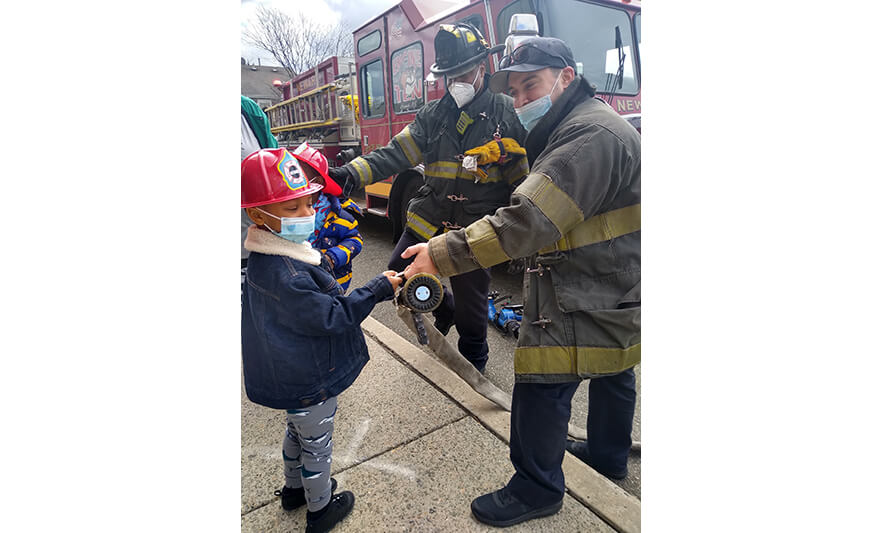 CHELC Fire Department Visit 4-16-2021 Boy Holding Hose for Web