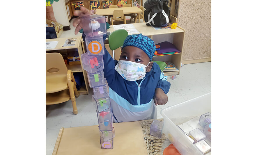 HHELC Week of the Young Child 2021 Boy Stacking Blocks for Web