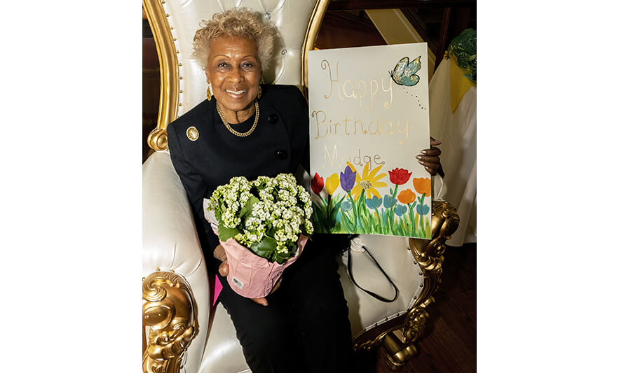 Madge Wilson 89th Birthday 4-12-2022 Madge Wilson with flowers and large card for web