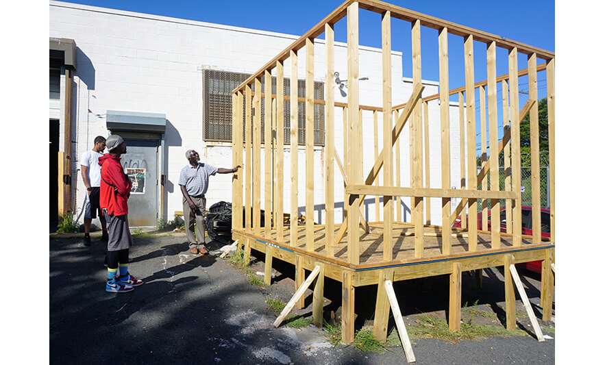 NCCTI Building Trades Open House 9-15-2022 Yusto Awich showing off outdoor build for web