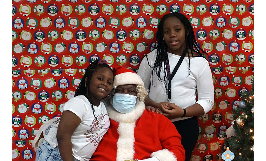 Breakfast with Santa 12-17-2022 Two girls with Santa for web