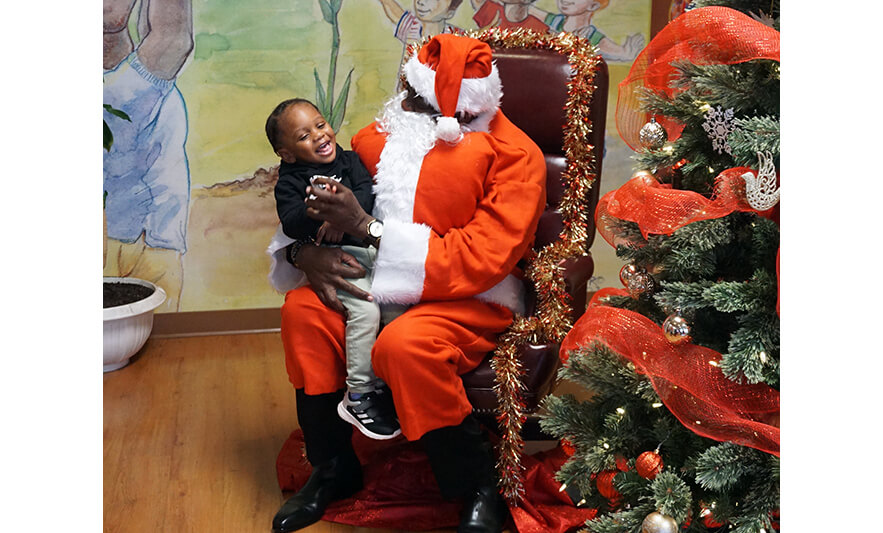 CHELC Santa Visit 12-16-2022 Boy laughing with Santa for web