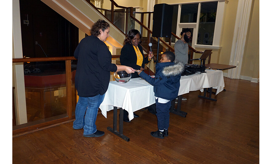 Withum Harmony House Thanksgiving Dinner 11-21-2022 Boy getting gift card for web