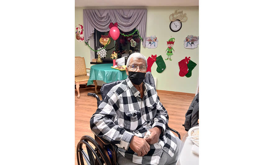 Extended Care Christmas 12-14-2022 Man in black and white for web