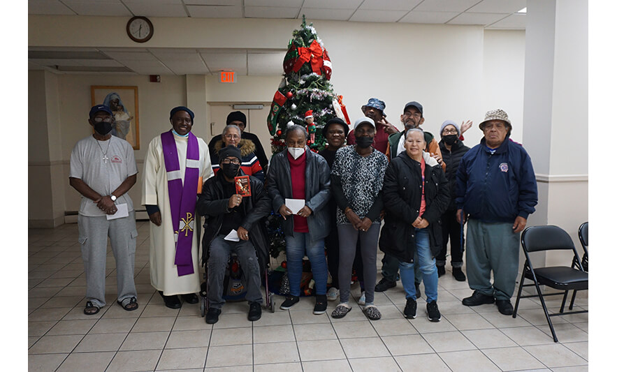 Manor Senior Crib Blessing 12-15-2022 Group by Christmas tree for web