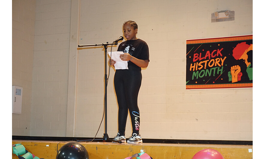 Youth Services Black History Month Program 2-24-2023 Girl reading poem for web