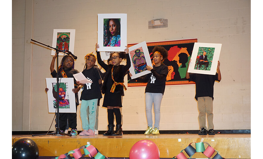 Youth Services Black History Month Program 2-24-2023 Group holding artwork for web