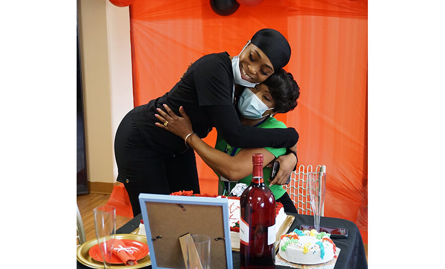 Extended Care Administrator Appreciation Luncheon 3-17-2023 Daughter hugging Veronica Onwunaka for web