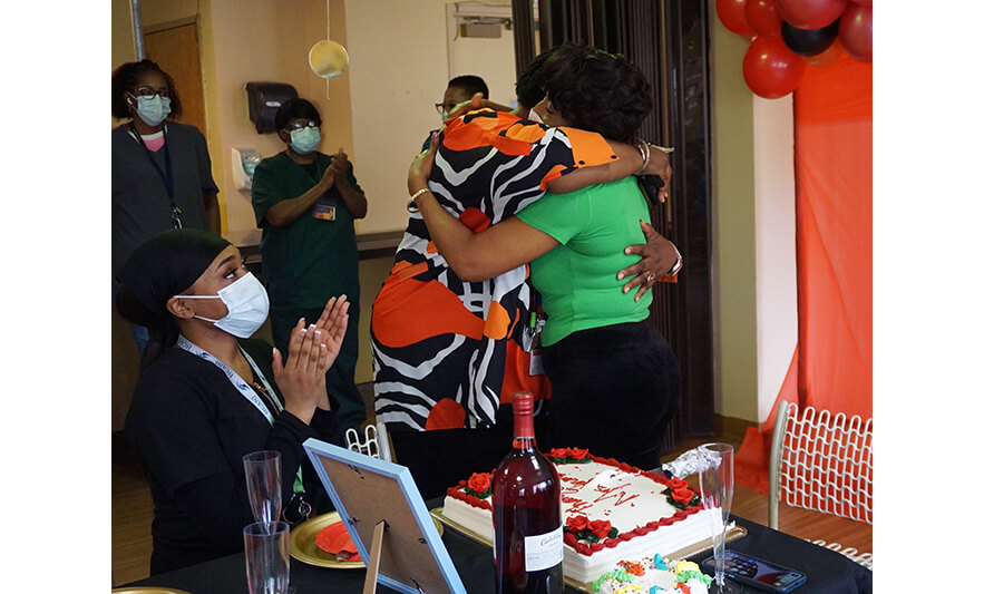 Extended Care Administrator Appreciation Luncheon 3-17-2023 Director of Nursing hugging Veronica Onwunaka for web