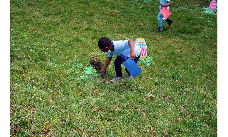CHELC Easter and Family Fun Day 4-6-2023 Boy in blue getting egg for web