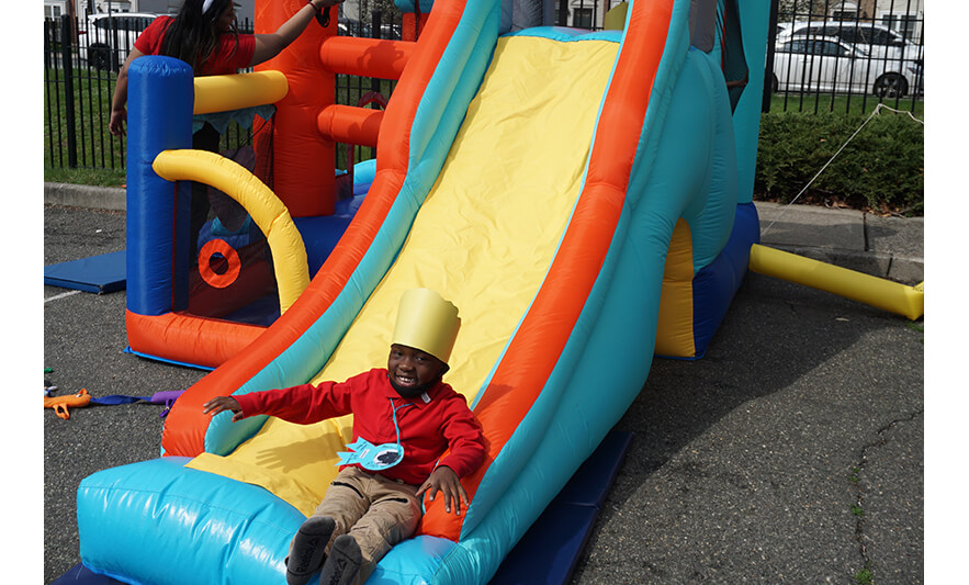 CHELC Easter and Family Fun Day 4-6-2023 Boy on inflatable slide for web