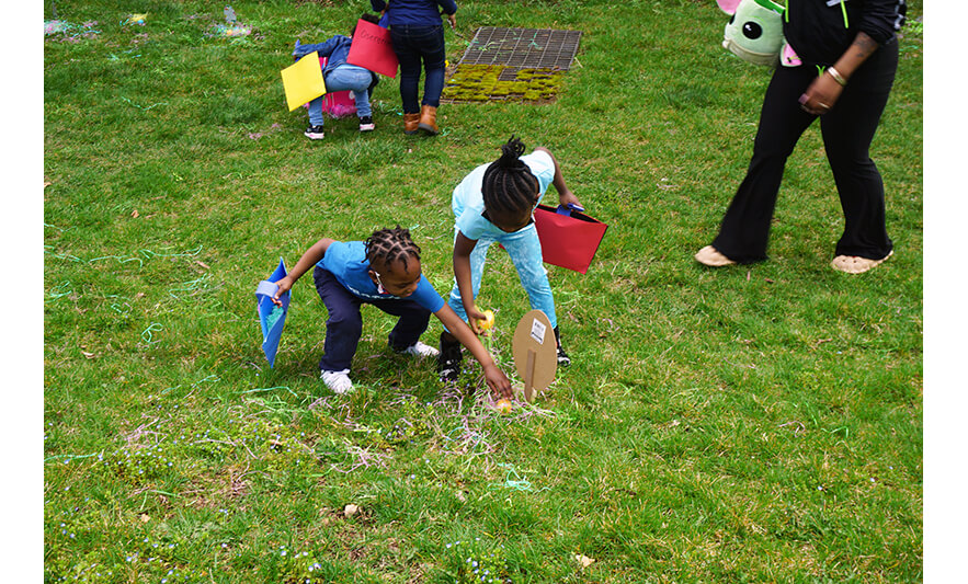 CHELC Easter and Family Fun Day 4-6-2023 Two kids in blue looking for eggs for web
