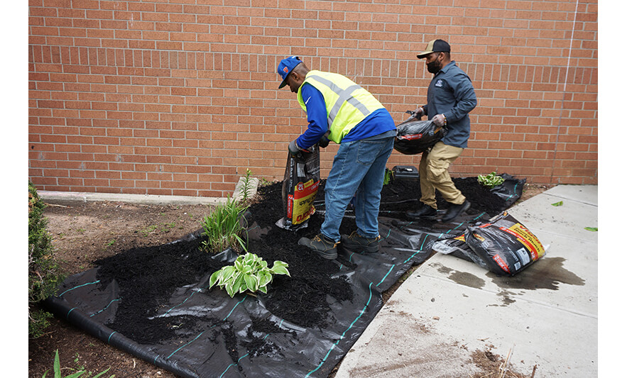 Spring Up Extended Care 4-28-2023 Emptying mulch on tarp for web