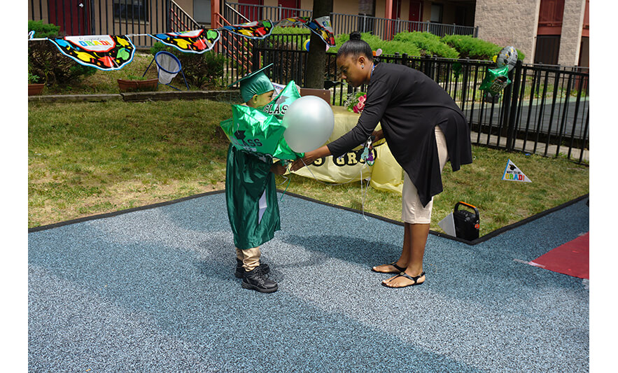 HHELC Graduation 6-21-2023 Mom giving son balloons for web