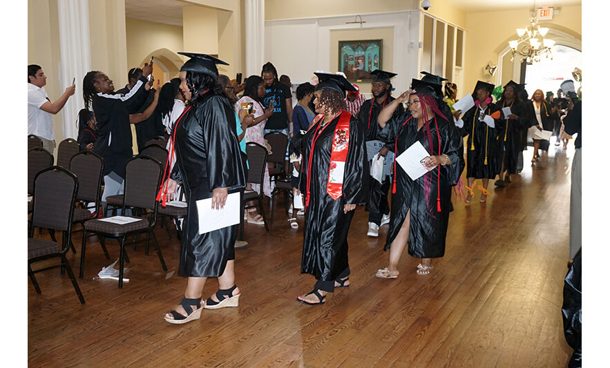NCCTI Graduation 6-30-2023 Graduates walking in for web