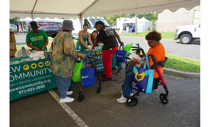 New Community Health Fair 7-27-2023 NCC residents at FSB table for web
