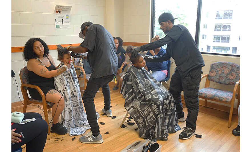 Harmony House Back to School 8-28-2023 Barbers cutting boys’ hair for web