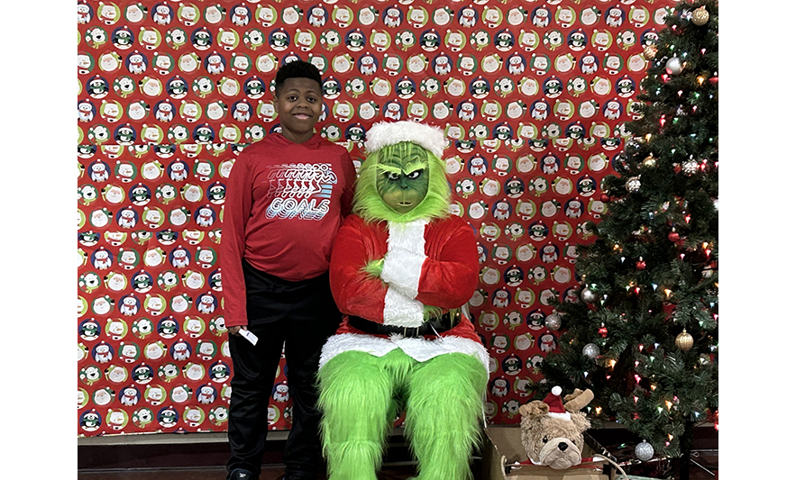 Youth Services Breakfast with the Grinch 12-16-2023 Boy with Grinch for web