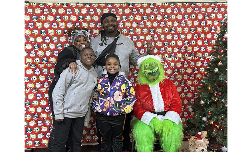 Youth Services Breakfast with the Grinch 12-16-2023 Family of 4 with Grinch for web