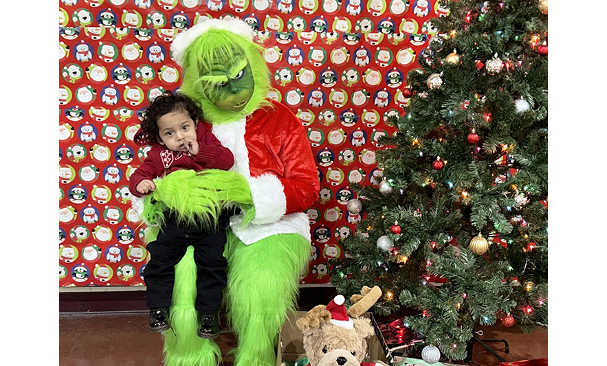 Youth Services Breakfast with the Grinch 12-16-2023 Little one with Grinch for web